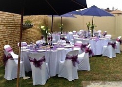 Colour scheme: White and two-tone purplish blue. Beachy Theme. white chaircovers and table cloths, two-tone tiebacks and overlays