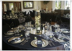 Barrel Vases 60cm, silver baseplates, black napkins, tiny candleholders, round mirrors, damask runner