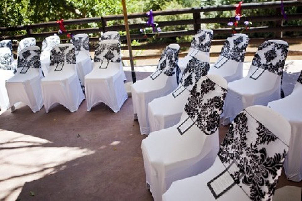 Damask tiebacks and white chaircovers